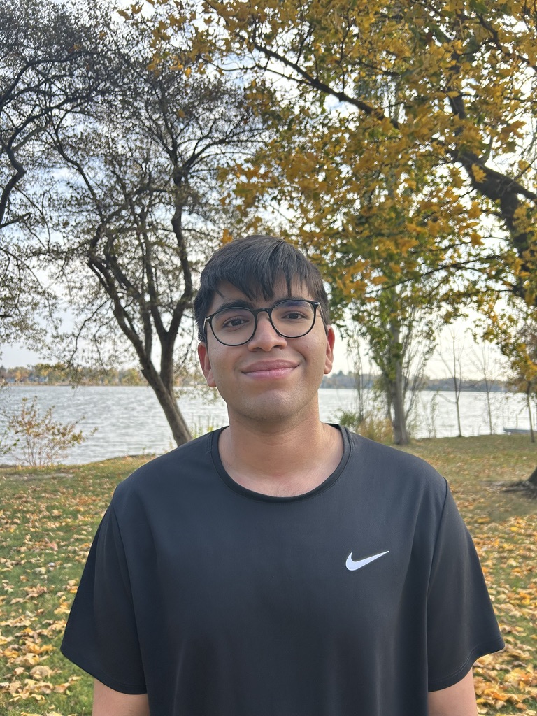 Portrait of Abhinav Nandwani beside a lake